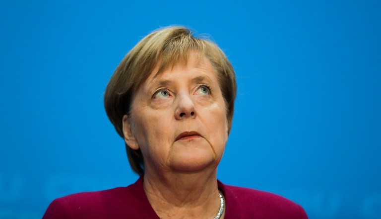 German Chancellor Angela Merkel looks up during a news conference after a party leaders meeting at the headquarters of the CDU in Berlin, Germany, Monday, Oct. 29, 2018.