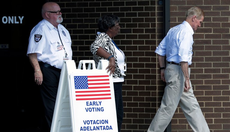 U.S. Sen. Bill Nelson, D-Fla., right, leaves the Orange County Supervisor of Elections office after casting his ballot during early voting Monday, Oct. 29, 2018, in Orlando, Fla.