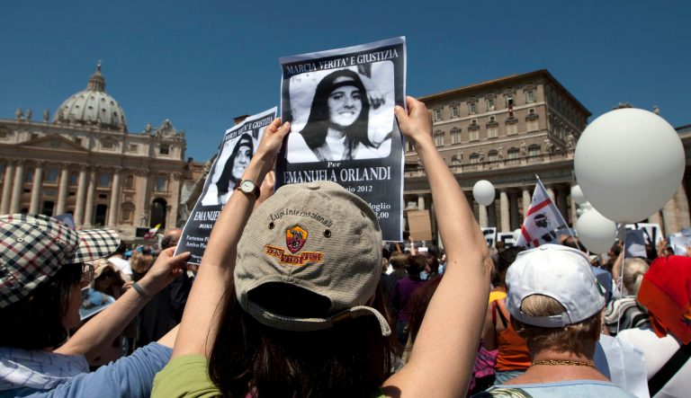In this May 27, 2012 photo, demonstrators hold pictures of Emanuela Orlandi reading "march for truth and justice for Emanuela" during Pope Benedict XVI's Regina Coeli prayer in St. Peter's square, at the Vatican. 