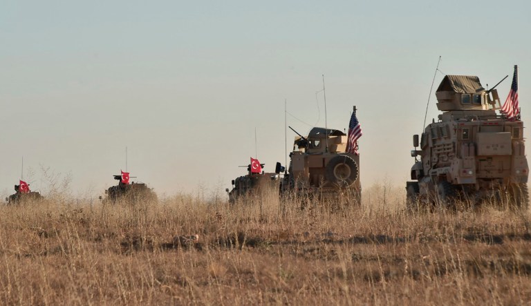 In this photo taken Thursday, Nov. 1, 2018, Turkish and U.S. troops conduct joint patrols around the Syrian town of Manbij, as part of an agreement that aimed to ease tensions between the two NATO allies. Turkish officials say U.S. President Donald Trump and Turkish President Recep Tayyip Erdogan discussed Syria and agreed to maintain "close contacts" concerning bilateral and regional issues in a telephone call on Thursday.