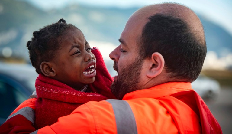A child is carried by a member of Spain's Maritime Rescue Service as they arrive at the port of San Roque, southern Spain, after being rescued in the Strait of Gibraltar on Saturday, Oct. 27, 2018. The organization saved 520 people trying to cross from Africa to Spain's shores on Saturday. Also, one boat with 70 migrants arrived to the Canary Islands. Over 1,960 people have died trying to cross the Mediterranean to Europe this year, according to the United Nations. 