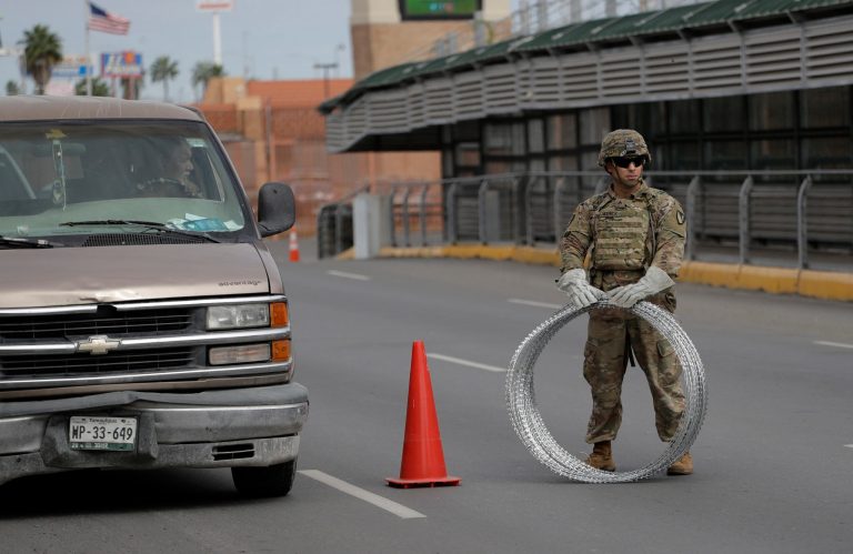 Members of the U.S.military place razor wire along the U.S.-Mexico border on the McAllen-Hidalgo International Bridge, Friday, Nov. 2, 2018, in McAllen, Texas.