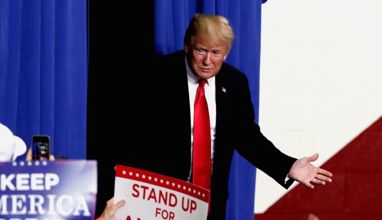 President Trump takes the stage to speak at a campaign rally.