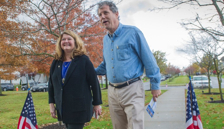 Sen. Sherrod Brown, D-Ohio, and his wife, Connie Schultz, walk to their polling station to vote, Tuesday, Nov. 6, 2018, in Cleveland.