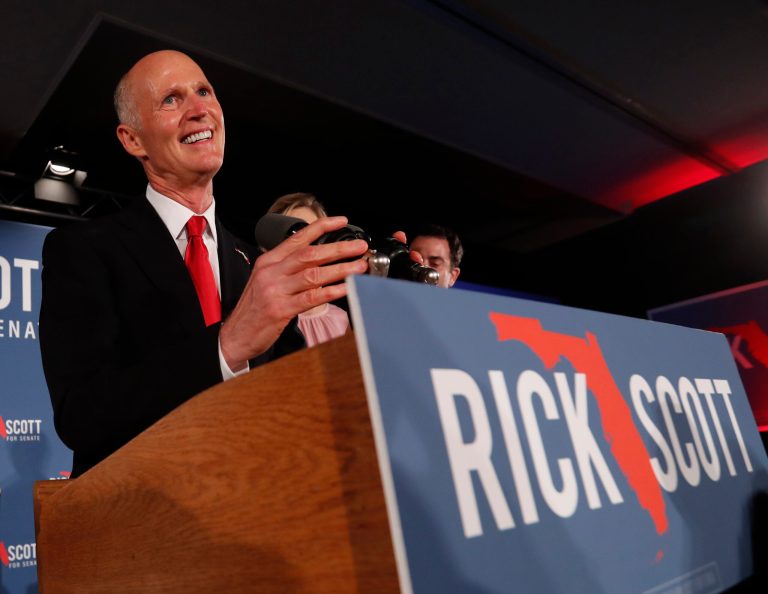 Republican Senate candidate Rick Scott smiles as he speaks to supporters at an election watch party, Wednesday, Nov. 7, 2018, in Naples, Fla.