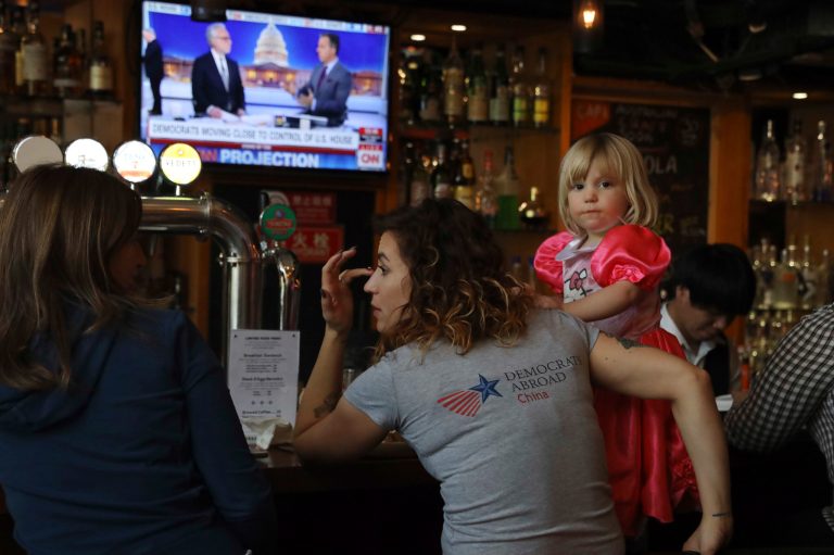 Christine Fox and her daughter Emmylou Fox from Washington State wait for the results of the United States midterm elections.
