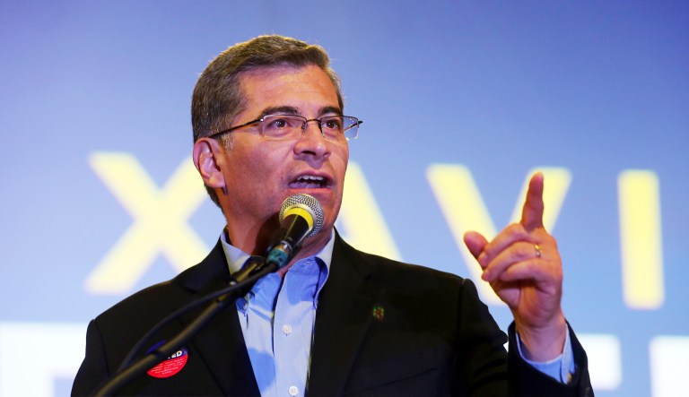 California Attorney General Xavier Becerra talks to supporters at a Democratic Party gathering at La Plaza de Cultura y Artes in the historic center of early Los Angeles Tuesday evening, Nov. 6, 2018.