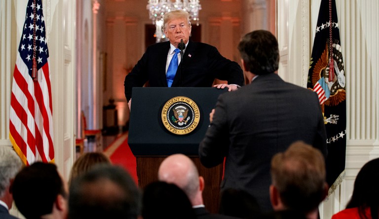 President Trump listens to a question from CNN journalist Jim Acosta during a news conference in the East Room of the White House in D.C.