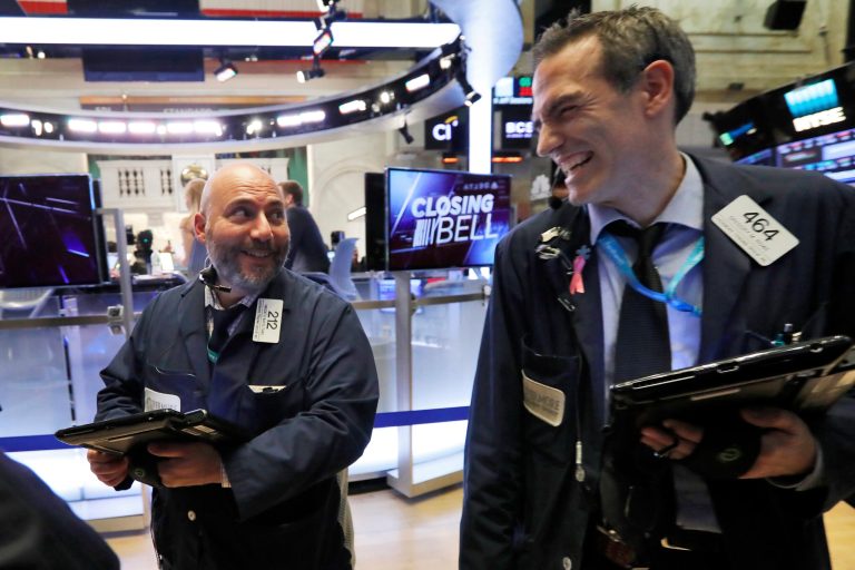 Trader colleagues Vincent Napolitano, left, and Gregory Rowe smile at the close of trading on the floor of the New York Stock Exchange, Wednesday, Nov. 7, 2018. Stocks closed sharply higher on Wall Street as investors are relieved that midterm elections went as they had expected, leaving split control of Congress.