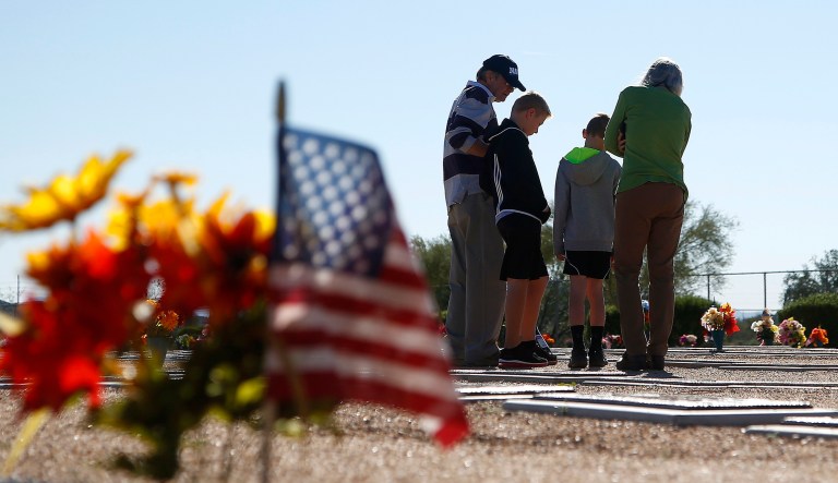 Visitors pay their respects at the National Memorial Cemetery of Arizona in Phoenix. 