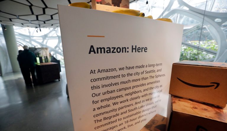 A display at Amazon's headquarters explains to visitors the contributions by the company in the city, Tuesday, Nov. 13, 2018, in Seattle.