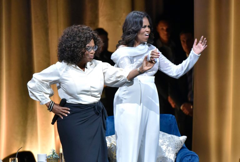 Is this the Democrat's 2020 ticket? Michelle Obama, right, is greeted by Oprah Winfrey to discusses her new book during an intimate conversation to promote "Becoming" at the United Center on Tuesday, Nov. 13, 2018, in Chicago. 