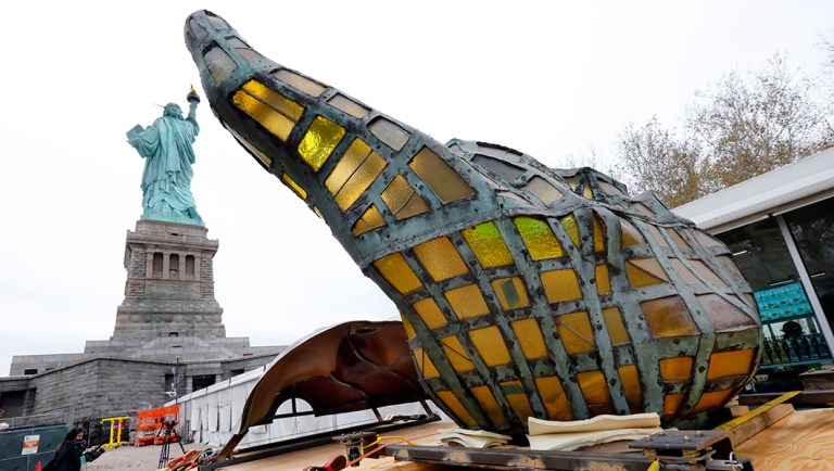 The original torch of the Statue of Liberty rests on a hydraulically stabilized transporter.