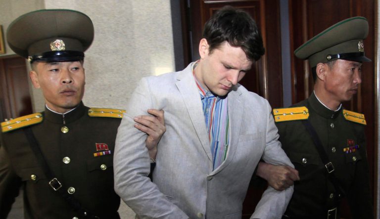 In this March 16, 2016 photo, American student Otto Warmbier, center, is escorted at the Supreme Court in Pyongyang, North Korea. 