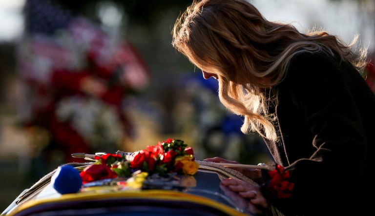 Tammy Taylor, mother of Maj. Brent Taylor, takes a moment beside his casket at the end of his interment at the Ben Lomond Cemetery in North Ogden on Saturday, Nov. 17, 2018. The Ogden, Utah mayor was killed on Nov. 3 while serving in the National Guard in Afghanistan.