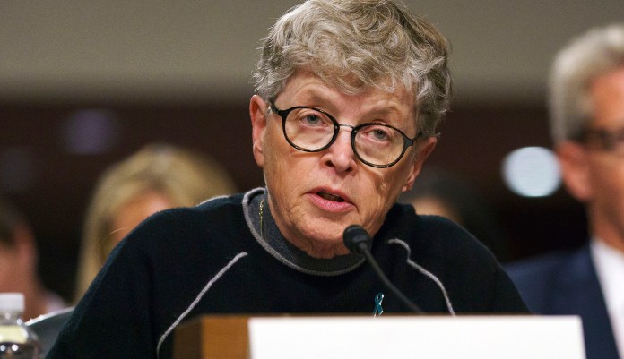FILE - In this June 5, 2018 file photo, former Michigan State President Lou Anna Simon testifies before a Senate subcommittee in Washington. Simon has been charged with lying to police conducting an investigation of Larry Nassar's sexual abuse. Simon, who stepped down earlier this year over the scandal, was charged Tuesday, Nov. 20, 2018, with two felonies and two misdemeanors.