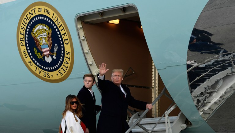 President Trump, first lady Melania Trump and their son Barron Trump walk up the steps of Air Force One at Andrews Air Force Base.