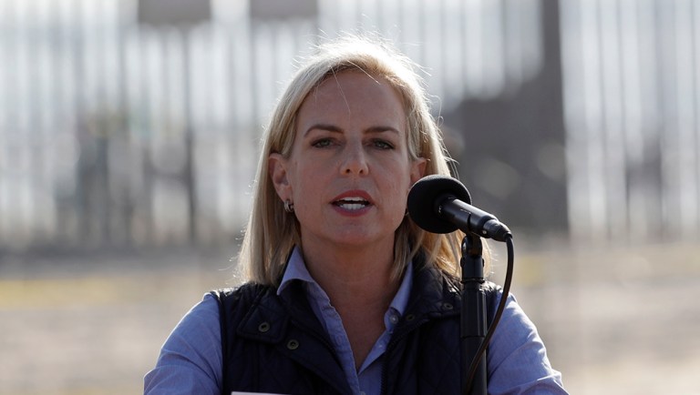 Secretary of Homeland Security Kirstjen Nielsen speaks in front of the border wall separating Tijuana, Mexico, and San Diego.