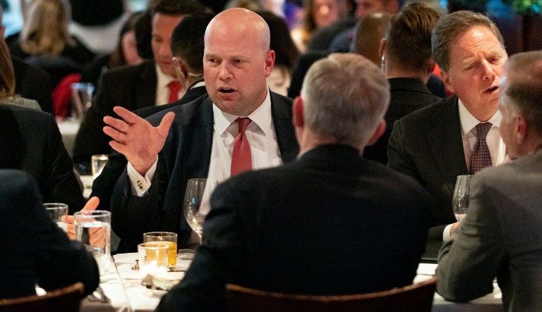 Acting U.S. Attorney General Matthew Whitaker, left, dines with other officials, Tuesday, Nov. 20, 2018, in New York. Before joining the Justice Department, Whitaker earned nearly $1 million from a right-leaning nonprofit that doesn't disclose its donors, according to financial disclosure forms released Tuesday. 