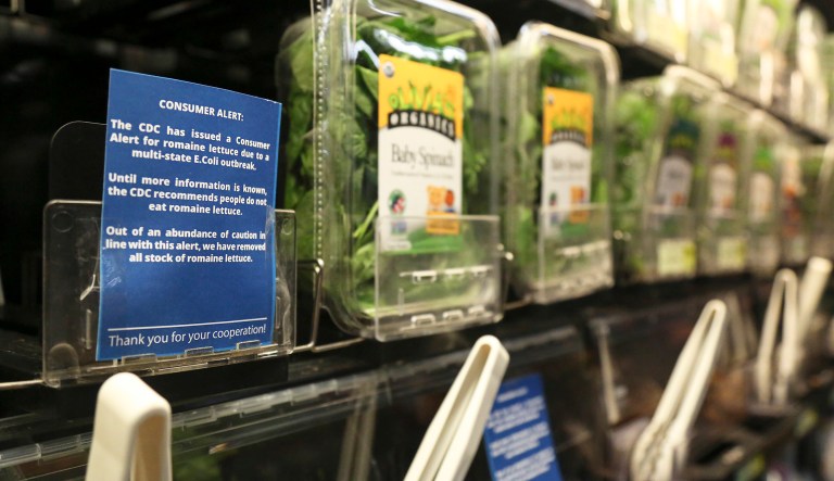 Romaine lettuce is removed from the shelves of the East End Food Co-op and other local grocery stores due to a recent consumer alert regarding a multi state E.Coli outbreak at the East End Food Co-op Tuesday, Nov. 20, 2018, in Pittsburgh. The Co-op has replaced their fresh and bagged romaine lettuce with blue signs reading, "The CDC has issued a Consumer Alert for romaine lettuce due to a multi state E.Coli outbreak."