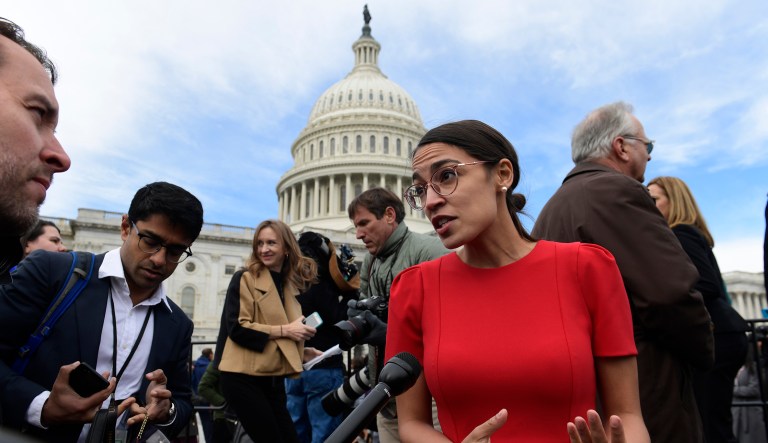 In this Nov. 14, 2018, file photo, Rep.-elect Alexandria Ocasio-Cortez, D-N.Y., talks with reporters following a photo opportunity on Capitol Hill in Washington, with the freshman class.