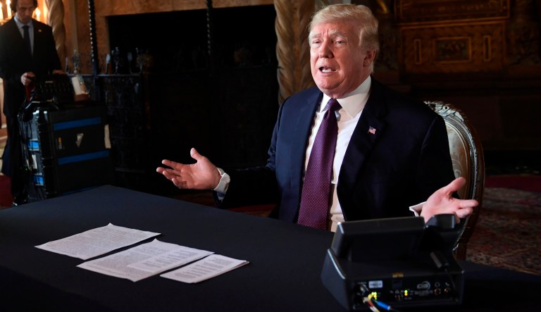 President Donald Trump speaks to reporters following his teleconference with troops from his Mar-a-Lago estate in Palm Beach, Fla., Thursday, Nov. 22, 2018.