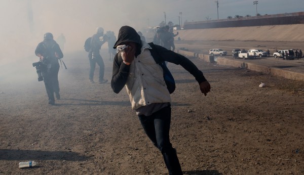 Border agents used tear gas only after being assaulted by asylum-seekers, official says