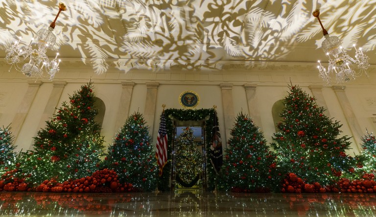 Grand Foyer and Cross Hall leading into the Blue Room and the official White House Christmas tree are seen during the 2018 Christmas Press Preview at the White House in Washington, Monday, Nov. 26, 2018. Christmas has arrived at the White House. First lady Melania Trump unveiled the 2018 White House holiday decor on Monday. She designed the decor, which features a theme of "American Treasures."