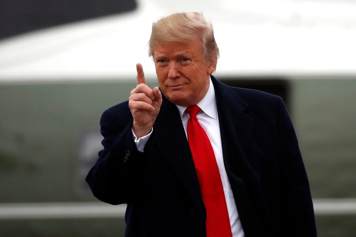 President Trump gestures as he walks to Air Force One as he departs Monday, Nov. 26, 2018, at Andrews Air Force Base, Md.
