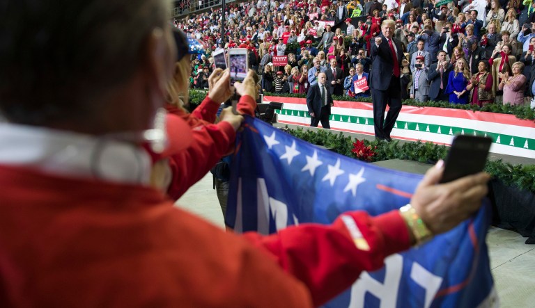 President Trump points to a supporter as he departs a rally for Sen. Cindy Hyde-Smith, R-Miss., at the Mississippi Coast Coliseum, Monday, Nov. 26, 2018, in Biloxi, Miss.
