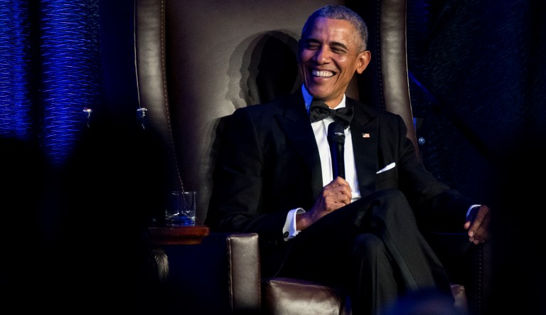 Former President Barack Obama speaks with Jon Meacham as he takes the stage during the 25th anniversary gala celebration for Rice University's Baker Institute for Public Policy on Tuesday, Nov. 27, 2018, in Houston.