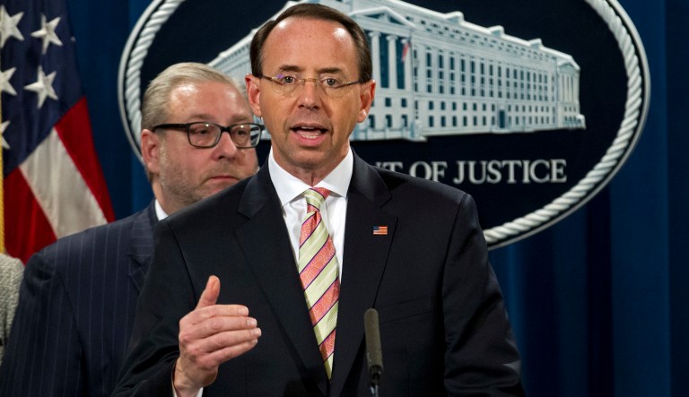 Deputy Attorney General Rod Rosenstein speaks during a news conference announcing the indictment against international computer hacking, at Department of Justice in Washington, Wednesday, Nov. 28, 2018. The Justice Department says two Iranian computer hackers have been charged in connection with multimillion-dollar cybercrime and extortion scheme that targeted U.S. government agencies and businesses.