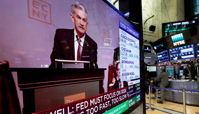 The speech of Federal Reserve Chairman Jerome Powell to the Economic Club of New York, appears on a television screen on the floor of the New York Stock Exchange, Wednesday, Nov. 28, 2018.
