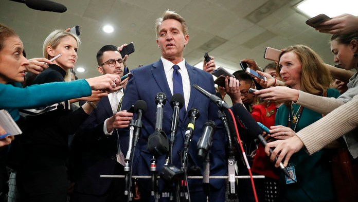 Sen. Jeff Flake, R-Ariz., speaks to members of the media.