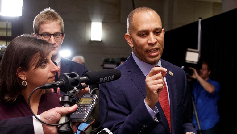 Rep. Hakeem Jeffries, D-N.Y., talks with reporters as he walks to Democratic Caucus leadership elections.