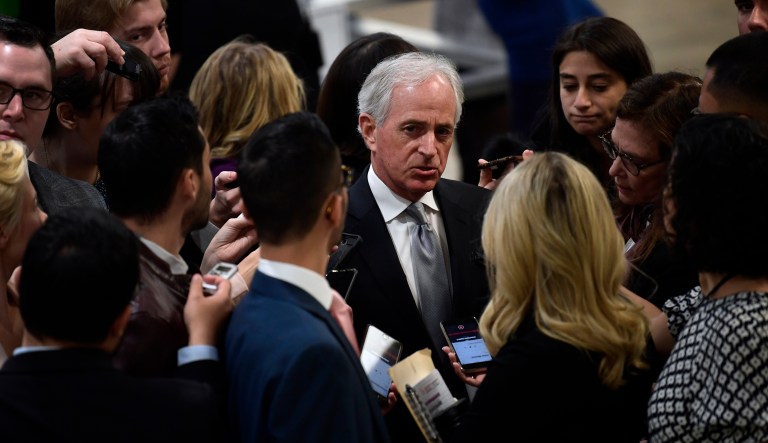 Sen. Bob Corker, R-Tenn., talks with reporters as he heads to a vote on Capitol Hill in Washington, Thursday, Nov. 29, 2018.