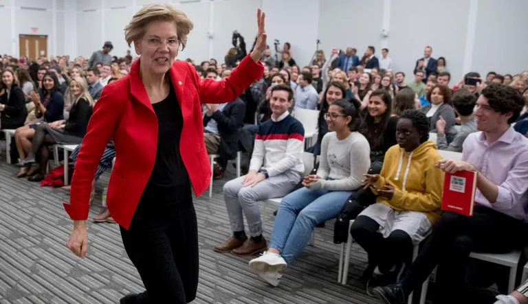 Sen. Elizabeth Warren, D-Mass., waves as she departs after speaking at the American University Washington College of Law in Washington, Thursday, Nov. 29, 2018, on her foreign policy vision for the country.