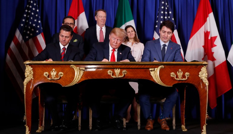 President Donald Trump, Canada's Prime Minister Justin Trudeau, right, and Mexico's President Enrique Pena Nieto, left, participate in the USMCA signing ceremony, Friday, Nov. 30, 2018 in Buenos Aires, Argentina. 