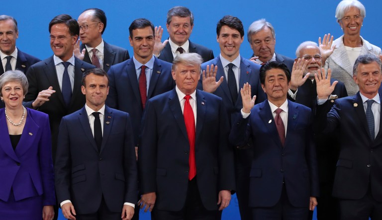 President Trump, front center, stands with other world leaders as they pose for a group picture at the start of the G20 Leader's Summit inside the Costa Salguero Center in Buenos Aires, Argentina, Friday.