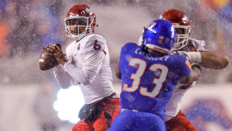 Fresno State quarterback Marcus McMaryion (6) looks for a receiver during the second half of an NCAA college football game against Boise State for the Mountain West championship.