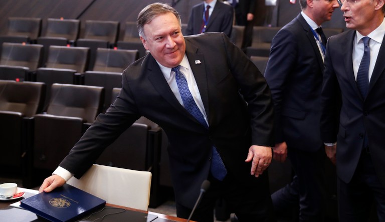 U.S. Secretary of State Mike Pompeo, left, speaks with NATO Secretary General Jens Stoltenberg, right, during a round table meeting of the North Atlantic Council with Georgia and Ukraine at NATO headquarters in Brussels, Tuesday, Dec. 4, 2018.
