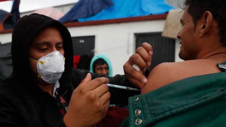 Mexican Health Ministry representatives give migrants free shots for the flu, hepatitis B, tetanus, and preventible children's diseases.