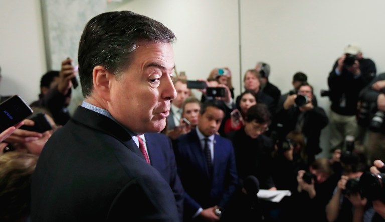 Former FBI Director James Comey speaks to reporters.