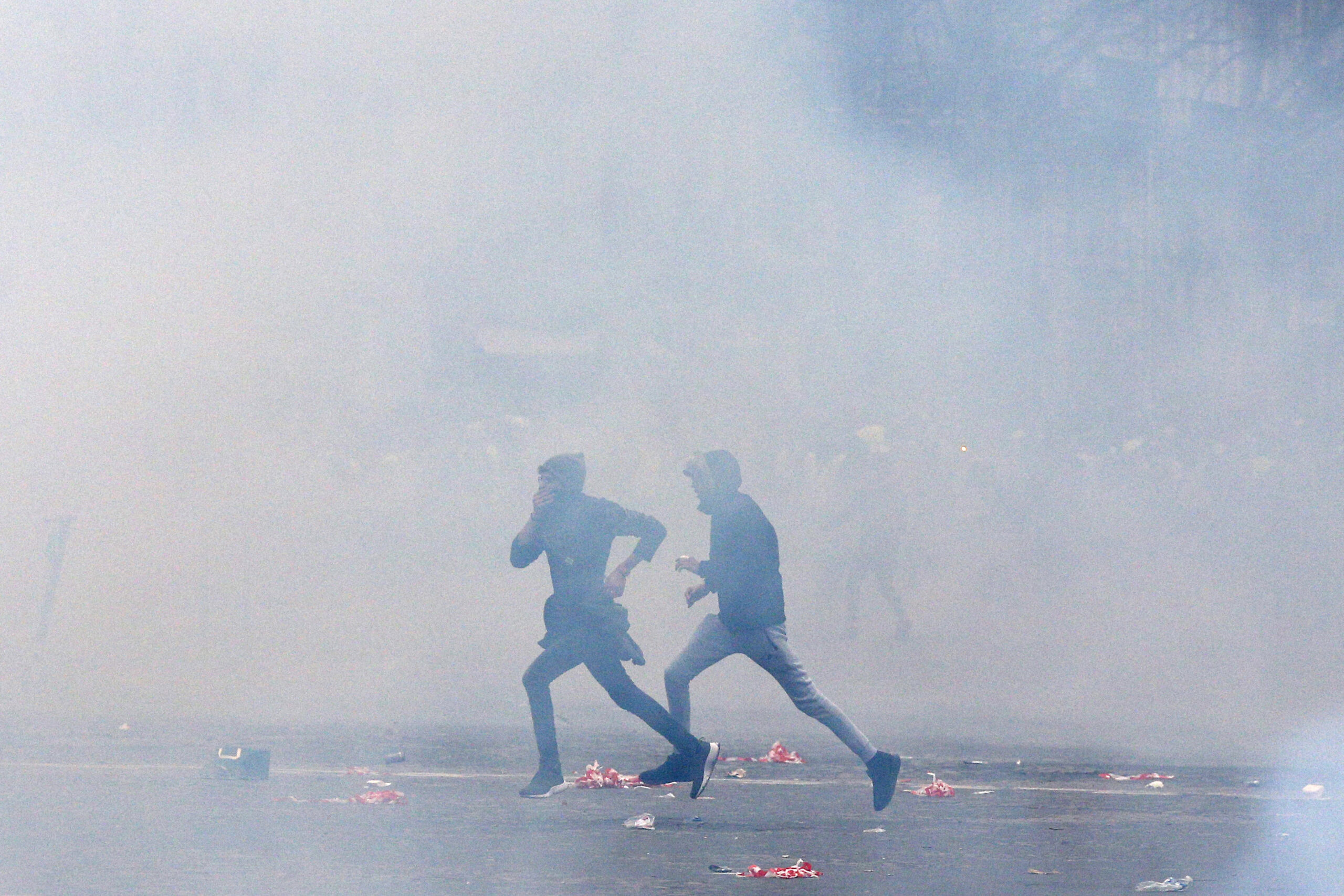 French police fire tear gas in Paris to halt angry protests