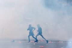 French police fire tear gas in Paris to halt angry protests