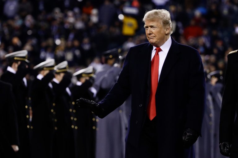 President Trump crosses the field after the first half of an NCAA college football game between the Army and the Navy, Saturday, Dec. 8, 2018, in Philadelphia.