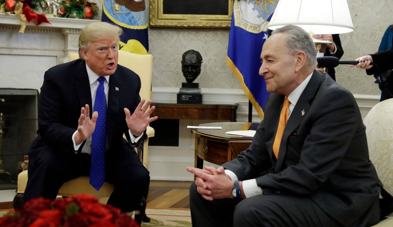 President Donald Trump meets with Senate Minority Leader Chuck Schumer, D-N.Y., right, and House Minority Leader Nancy Pelosi, D-Calif., not shown, in the Oval Office of the White House, Tuesday, Dec. 11, 2018, in Washington.