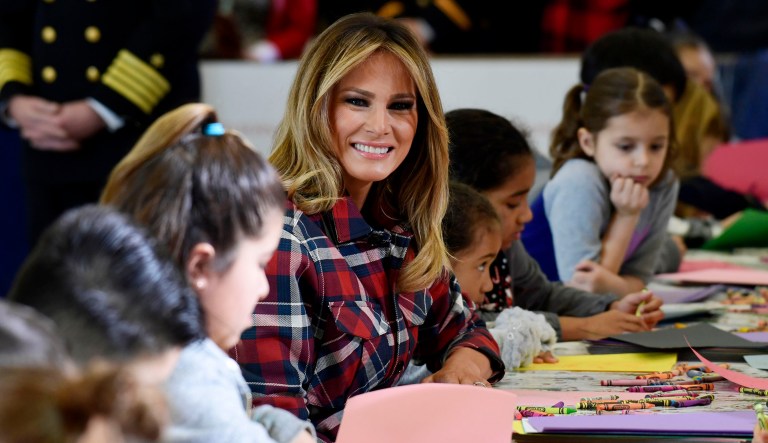 First lady Melania Trump speaks with children during a Toys for Tots event at Joint Base Anacostia-Bolling in Washington, D.C.