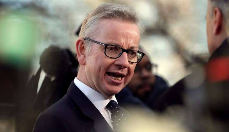 Britain's environment secretary Michael Gove speaks to the media outside the Houses of Parliament, in London, Wednesday December 12, 2018. 