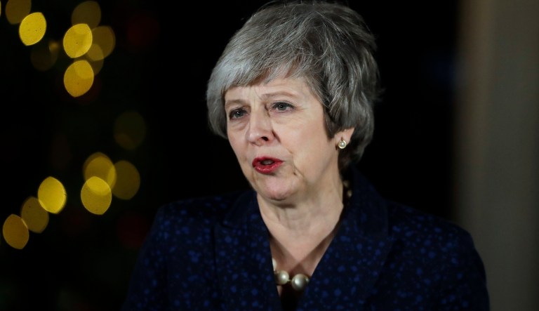 Britain's Prime Minister Theresa May delivers a speech outside 10 Downing Street in London, Wednesday, Dec. 12, 2018. British Prime Minister Theresa May survived a brush with political mortality Wednesday, winning a no-confidence vote of her Conservative lawmakers that would have ended her leadership of party and country.